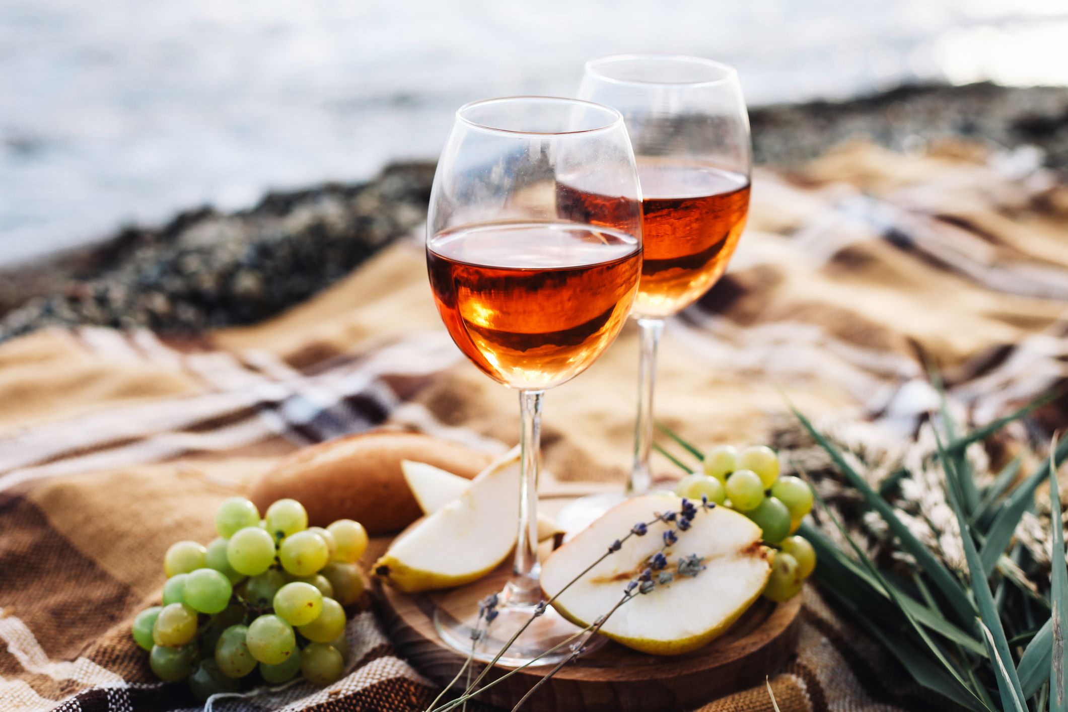 two-glasses-of-wine-and-summer-fruits-on-the-beach-royalty-free-image-1635272439